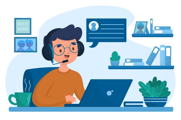 Young Man Using a Headset and Laptop for Online Communication