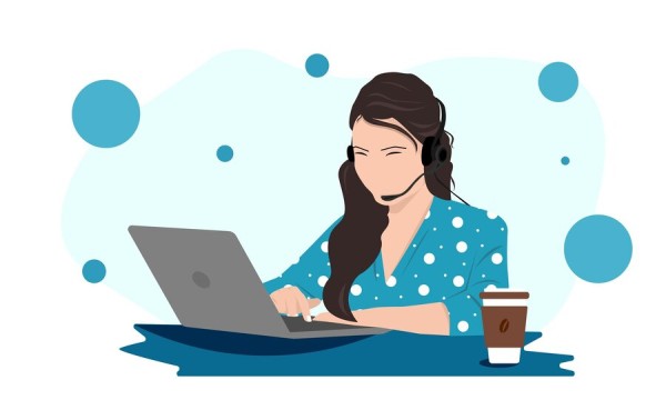 Woman Using a Headset on a Laptop for Seamless Online Calls
